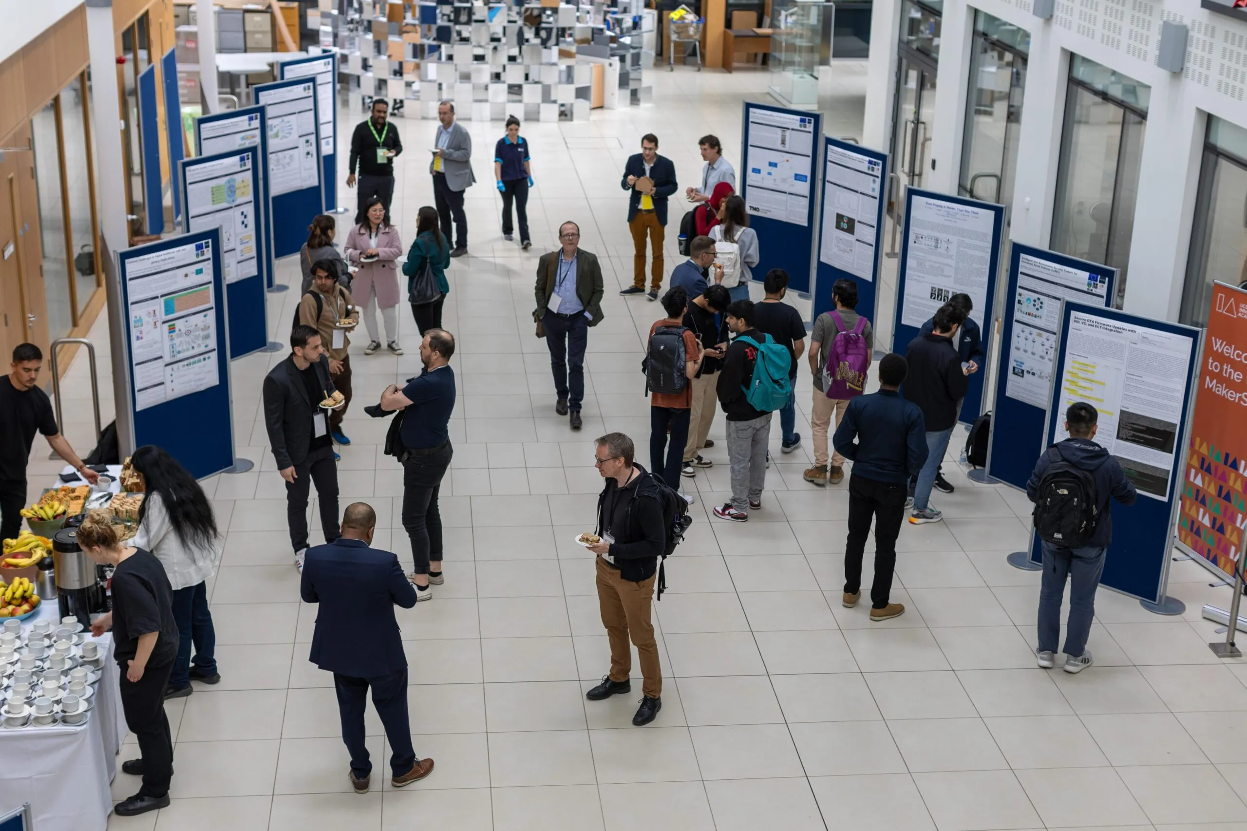 Attendees at the SECURENET 2024 poster session